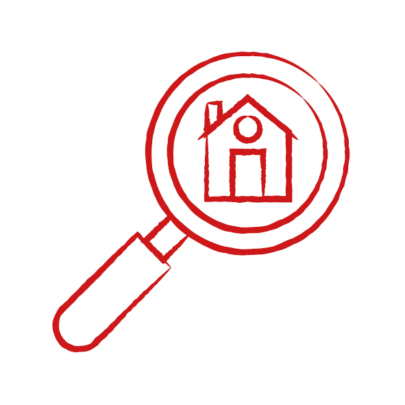 Rotes Haus mit einer Lupe davor als Symbol für Wohnungssuche